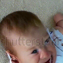 cute baby laughing hysterically